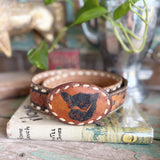 Vintage 32” tooled leather backstitch belt and angus buckle