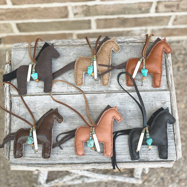 Handmade leather horse ornaments with beaded accents