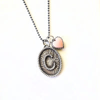 Handmade sterling silver initial necklace with pink conch heart