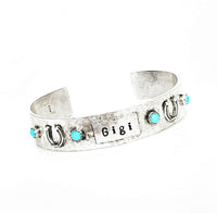 Custom sterling name cuff with 4 Sleeping Beauty stones