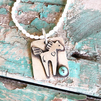 Artisan made horse pendant with turquoise stone