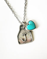 Handmade sterling silver ear tag and heart necklace
