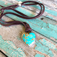 Turquoise heart necklace on deerskin