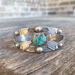Vintage Navajo arrow cuff with turquoise stone