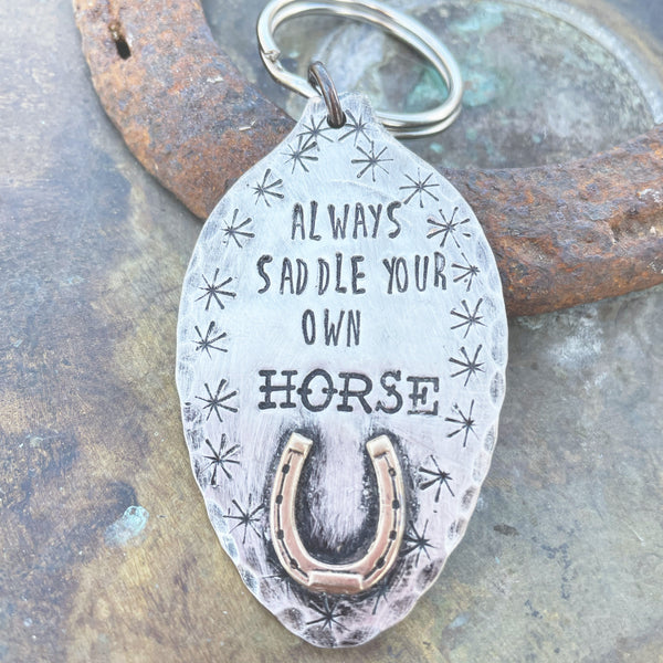 Hand stamped always saddle your own horse keychain