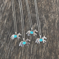 Navajo made sterling silver and turquoise horse necklace