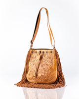Tooled leather purse with fringe